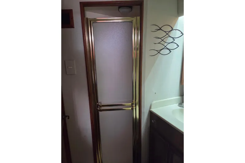 Slide: The Image of Shower door in 1990 Egg Harbor Golden Egg 42 yacht bathroom. - 27