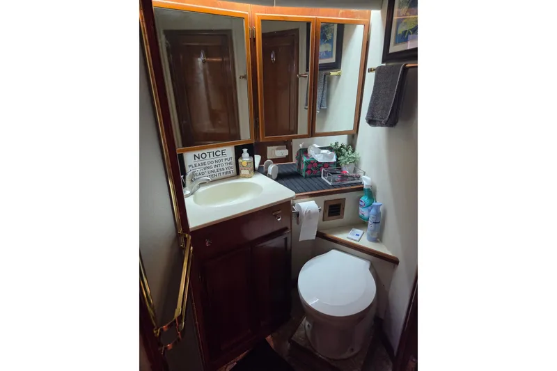 Slide: The Image of Bathroom interior of 1990 Egg Harbor Golden Egg 42 yacht, featuring sink and toilet. - 29