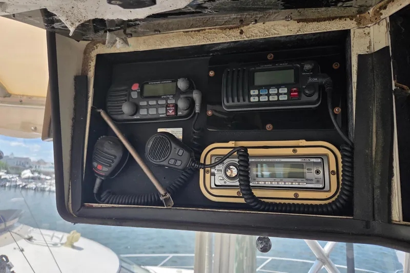 Slide: The Image of Control panel of a 1990 Egg Harbor Golden Egg 42 boat with communication devices. - 35