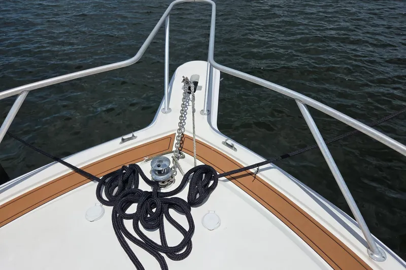 Slide: The Image of Bow of 1990 Egg Harbor Golden Egg 42 yacht with anchor chain and ropes. - 38