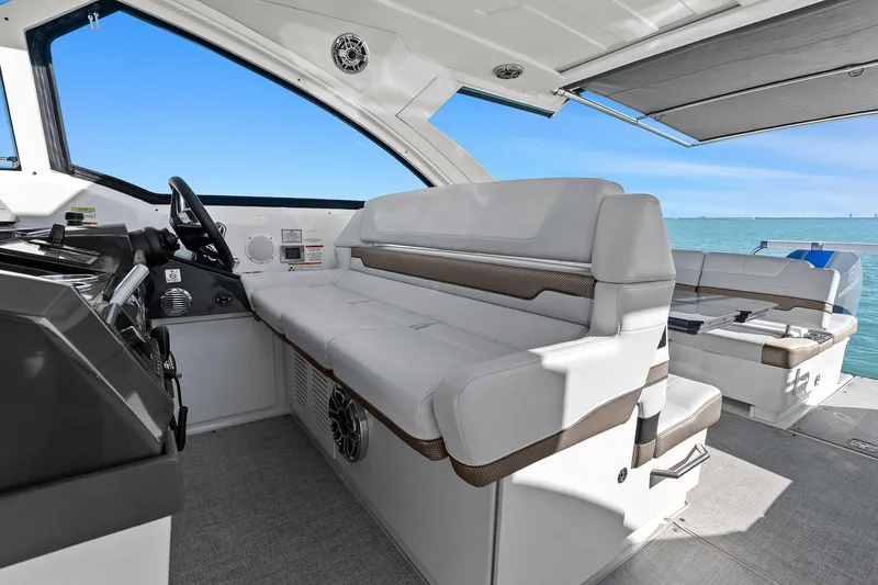 Slide: The Image of 2023 Formula 380 Super Sport Crossover OB interior with luxurious seating and ocean view. - 20