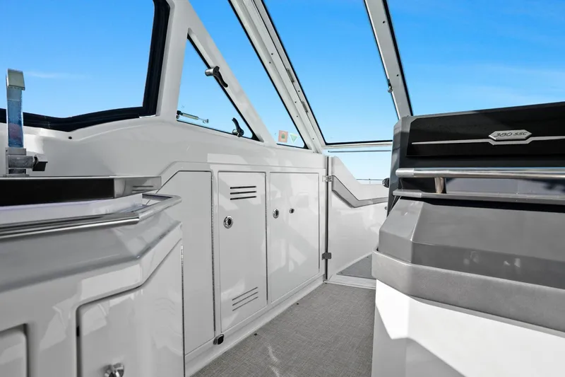 Slide: The Image of Interior view of 2023 Formula 380 Super Sport Crossover OB boat cockpit. - 25