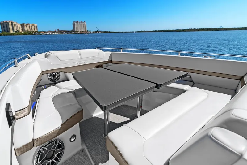 Slide: The Image of Luxurious seating area on 2023 Formula 380 Super Sport Crossover OB boat, with scenic water view. - 27