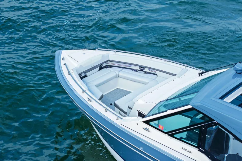 Slide: The Image of 2023 Formula 380 Super Sport Crossover OB boat on water, featuring sleek design and spacious seating. - 3
