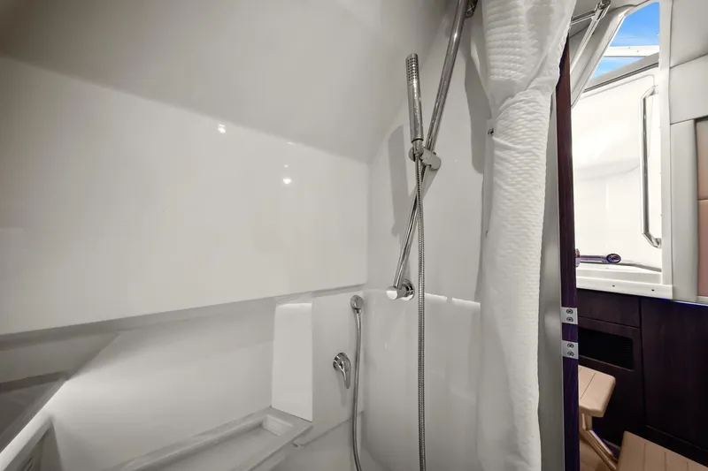 Slide: The Image of Interior shower of 2023 Formula 380 Super Sport Crossover OB boat, featuring sleek design. - 33