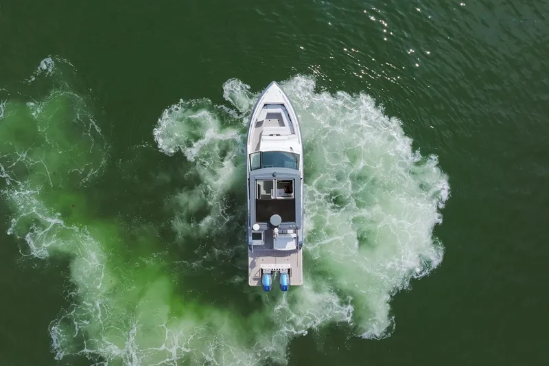 Slide: The Image of Aerial view of 2023 Formula 380 Super Sport Crossover OB on green water. - 5