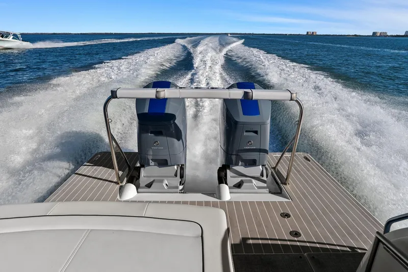 Slide: The Image of 2023 Formula 380 Super Sport Crossover OB cruising on open water, showcasing powerful dual outboard engines. - 8