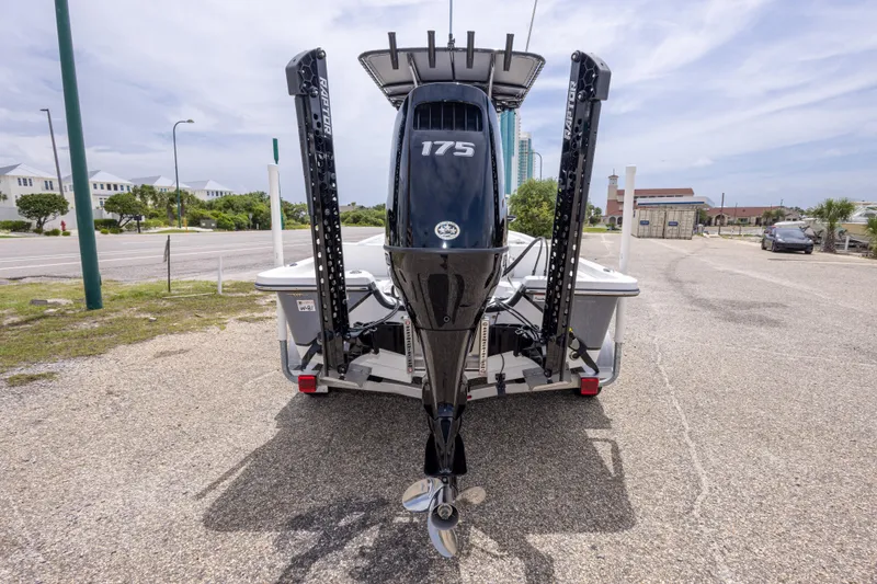 Slide: The Image of 2023 Blazer Bay 2200 boat with 175 horsepower engine, parked on a sunny day. - 17