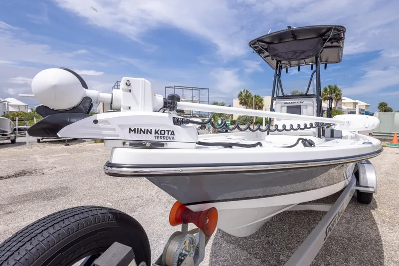 Slide: The Image of 2023 Blazer Bay 2200 boat with Minn Kota Terrova motor, parked on a trailer. - 19
