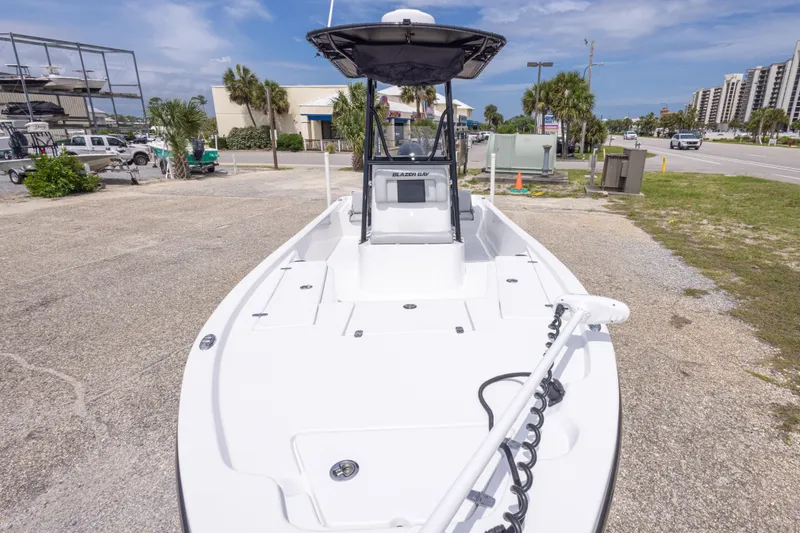 Slide: The Image of 2023 Blazer Bay 2200 boat on display in a sunny outdoor setting. - 20