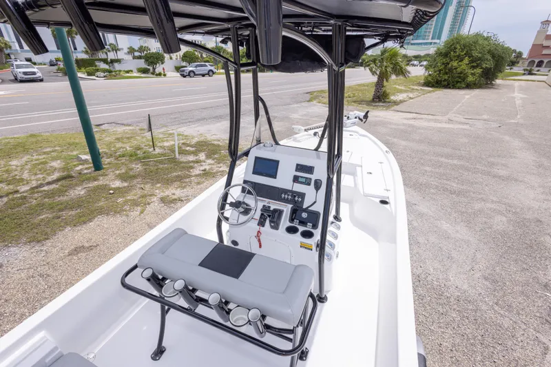 Slide: The Image of 2023 Blazer Bay 2200 boat interior with steering console and seating. - 22