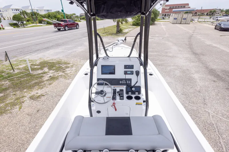 Slide: The Image of 2023 Blazer Bay 2200 boat console with steering wheel and navigation system. - 23