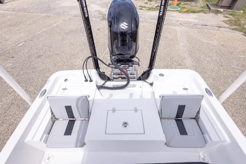 Slide: The Image of 2023 Blazer Bay 2200 boat with dual seats and outboard motor. - 29