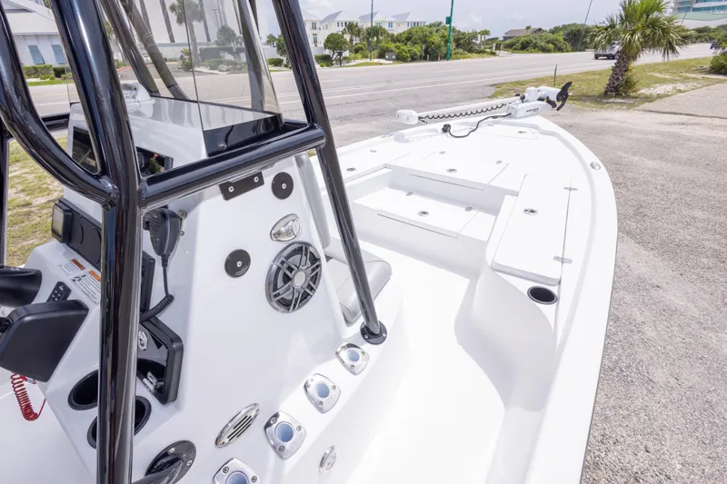 Slide: The Image of 2023 Blazer Bay 2200 boat with sleek design and modern features, parked near a road. - 30