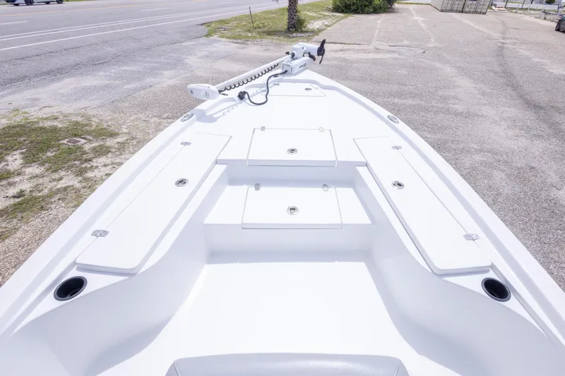 Slide: The Image of 2023 Blazer Bay 2200 boat deck with storage compartments and trolling motor. - 32