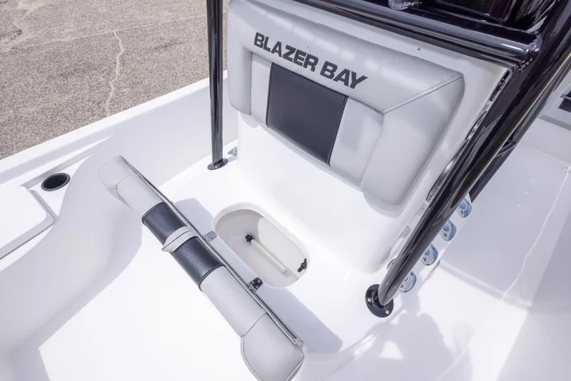 Slide: The Image of 2023 Blazer Bay 2200 boat interior with seating and storage compartment. - 36