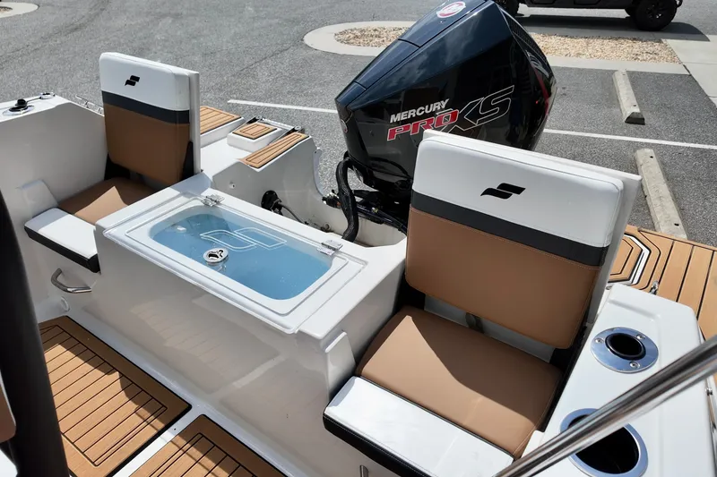 Slide: The Image of 2026 Starcraft SVX 191 OB CC boat interior with Mercury Pro XS engine. - 11