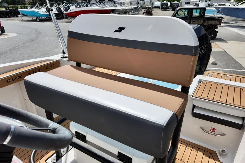 Slide: The Image of 2026 Starcraft SVX 191 OB CC boat interior with tan and gray seating, showcasing modern design. - 15