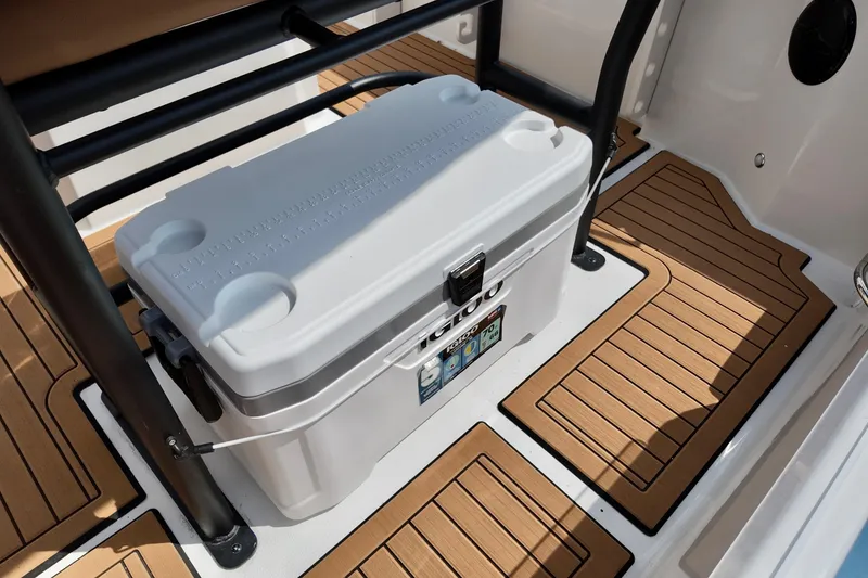 Slide: The Image of 2026 Starcraft SVX 191 OB CC boat interior with cooler and teak flooring. - 16