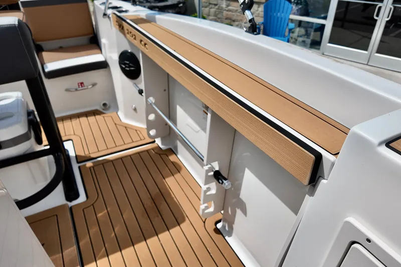 Slide: The Image of 2026 Starcraft SVX 191 OB CC boat interior with teak flooring and seating. - 17