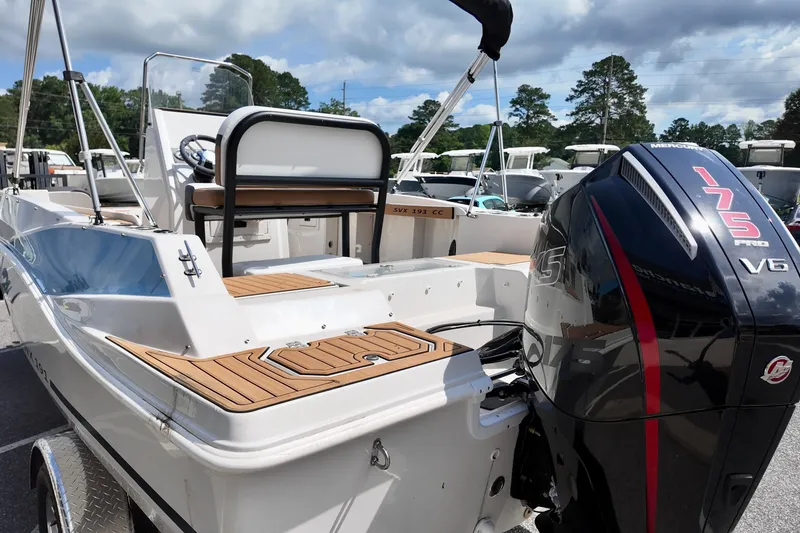 Slide: The Image of 2026 Starcraft SVX 191 OB CC boat with Mercury 175 Pro V6 engine, docked outdoors. - 3