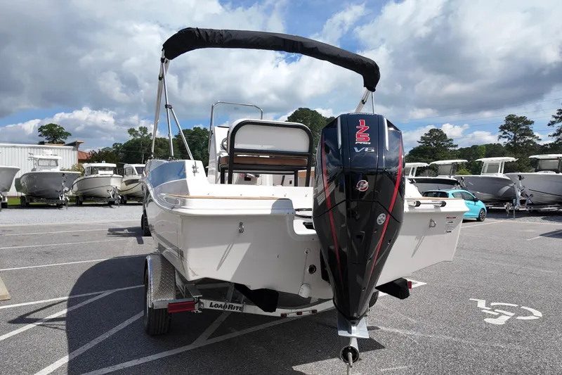 Slide: The Image of 2026 Starcraft SVX 191 OB CC boat with V6 engine in a parking lot. - 4
