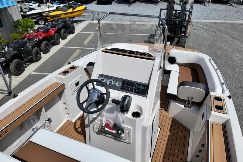 Slide: The Image of 2026 Starcraft SVX 191 OB CC boat interior with modern dashboard and seating. - 6