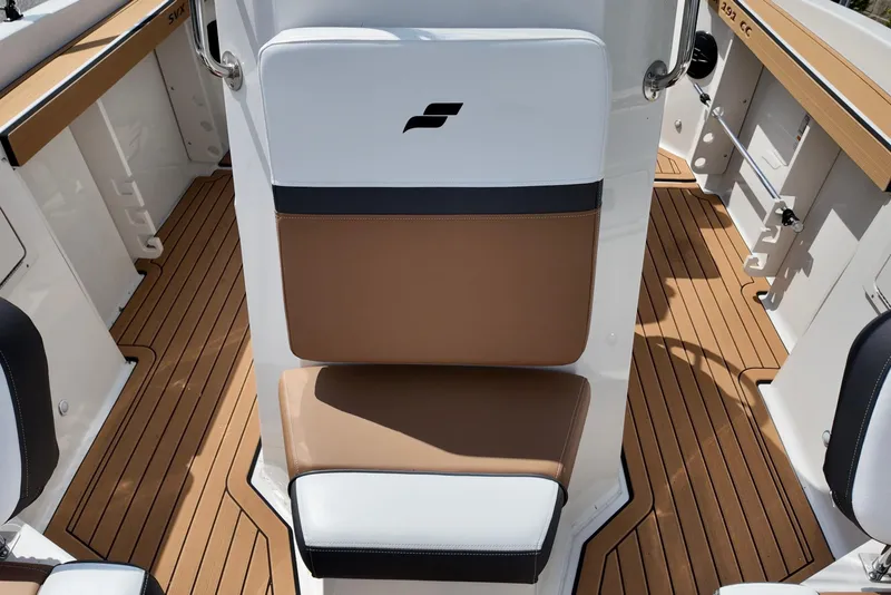 Slide: The Image of 2026 Starcraft SVX 191 OB CC boat interior with tan and white seating. - 9