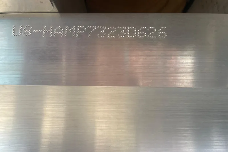 Slide: The Image of VIN number engraved on metal surface of 2026 Harris Cruiser 230 SLDH boat. - 12