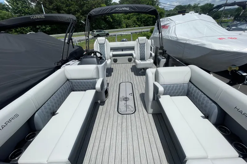 Slide: The Image of 2026 Harris Cruiser 230 SLDH pontoon boat interior with luxurious seating and modern design. - 7