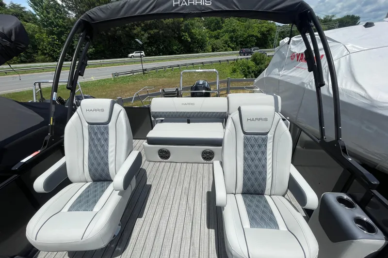 Slide: The Image of 2026 Harris Cruiser 230 SLDH pontoon boat interior with luxurious seating and modern design. - 8