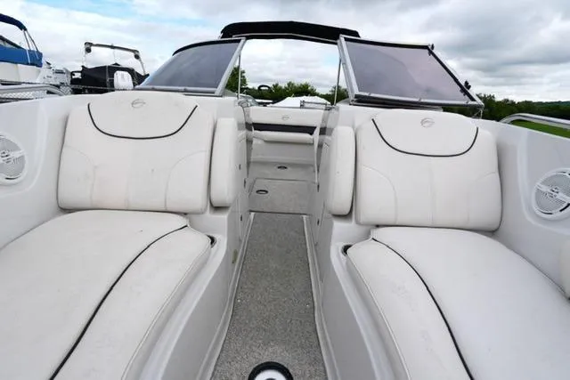 Slide: The Image of 2008 Crownline 230 LS boat interior with white seating and open deck layout. - 10