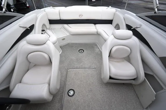 Slide: The Image of 2008 Crownline 230 LS boat interior with white seating and spacious layout. - 11