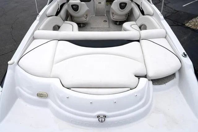 Slide: The Image of 2008 Crownline 230 LS boat interior with white seating and sleek design. - 16