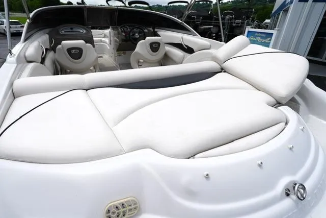Slide: The Image of 2008 Crownline 230 LS boat with white leather seating and sleek interior design. - 17