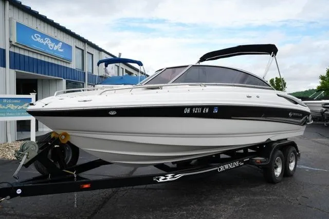 Slide: The Image of 2008 Crownline 230 LS boat on trailer outside Sea Ray dealership. - 2