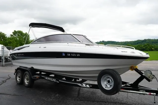 Slide: The Image of 2008 Crownline 230 LS boat on trailer, parked outdoors on a cloudy day. - 3