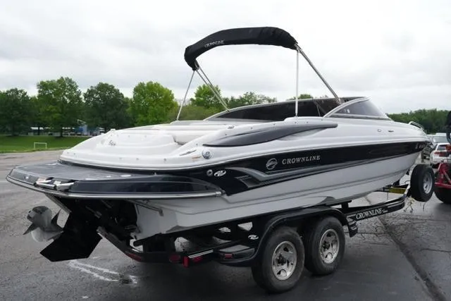 Slide: The Image of 2008 Crownline 230 LS boat on trailer, parked outdoors. - 5