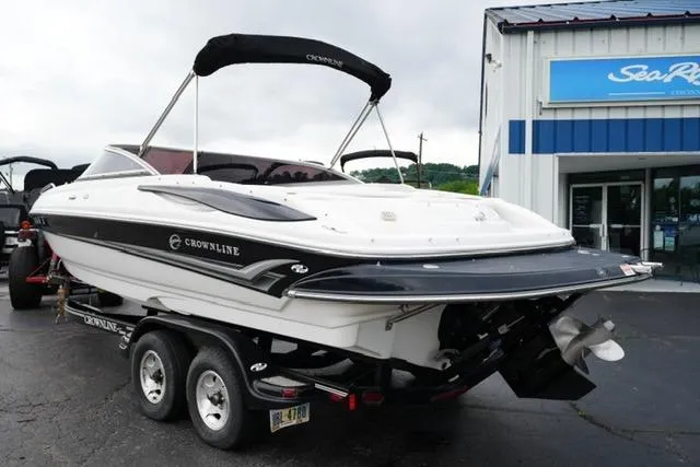 Slide: The Image of 2008 Crownline 230 LS boat on trailer outside dealership. - 7