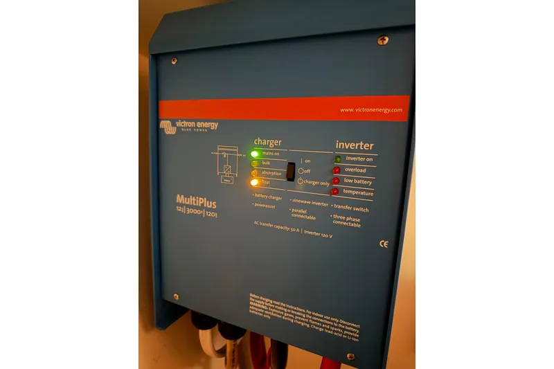 Slide: The Image of Victron Energy MultiPlus inverter charger with status lights, model 12|3000|120, in a 1988 Monk 36. - 30