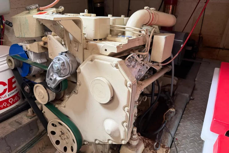 Slide: The Image of 1988 Monk 36 engine in a mechanical room, featuring belts and pulleys. - 33