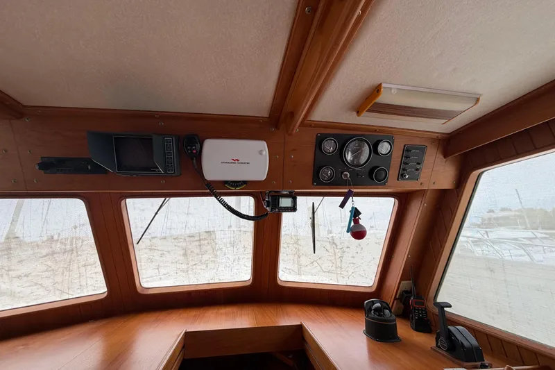 Slide: The Image of Interior of a 1988 Monk 36 boat cockpit with navigation instruments and controls. - 6