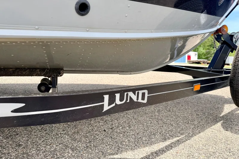 Slide: The Image of 2003 Lund 1675 Adventure SS boat on trailer, close-up view. - 13