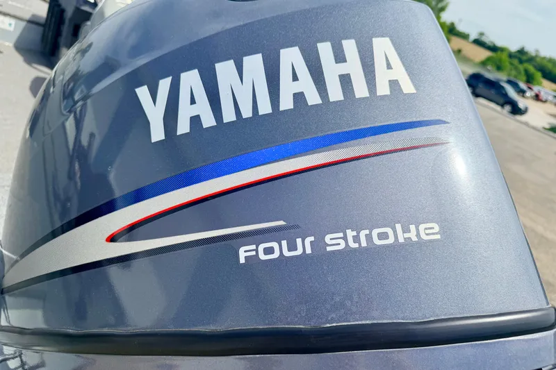 Slide: The Image of Yamaha four-stroke engine on a 2003 Lund 1675 Adventure SS boat. - 19