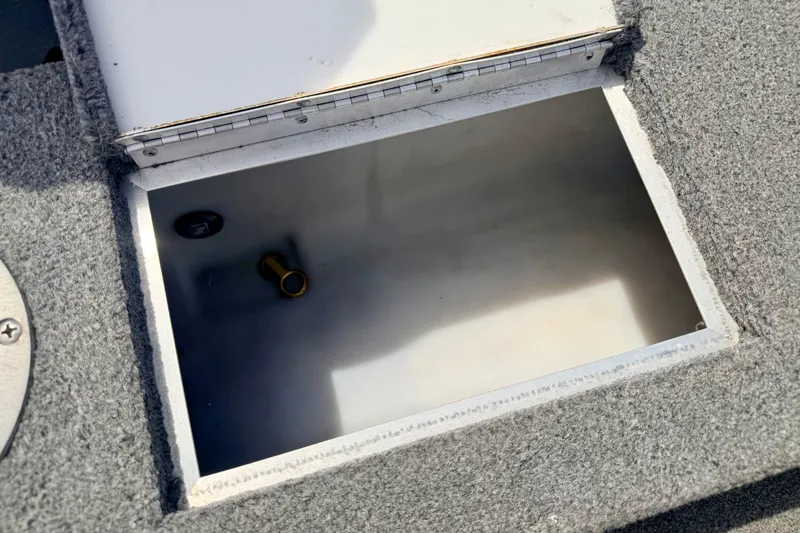 Slide: The Image of Open storage compartment in a 2003 Lund 1675 Adventure SS boat. - 29