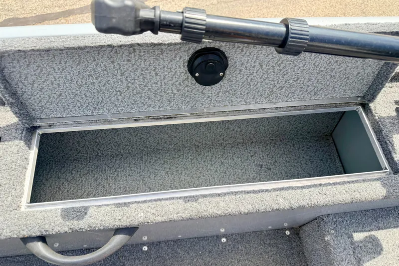 Slide: The Image of Open storage compartment on a 2003 Lund 1675 Adventure SS boat. - 31