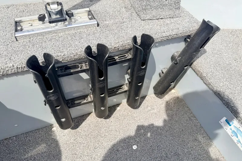 Slide: The Image of Rod holders on a 2003 Lund 1675 Adventure SS boat deck. - 46