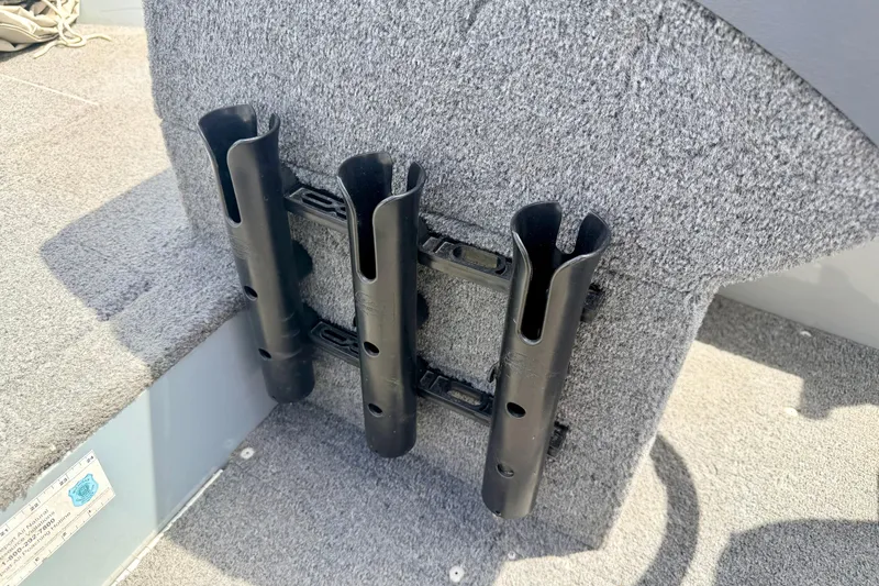 Slide: The Image of Rod holders on a 2003 Lund 1675 Adventure SS boat, carpeted interior. - 47
