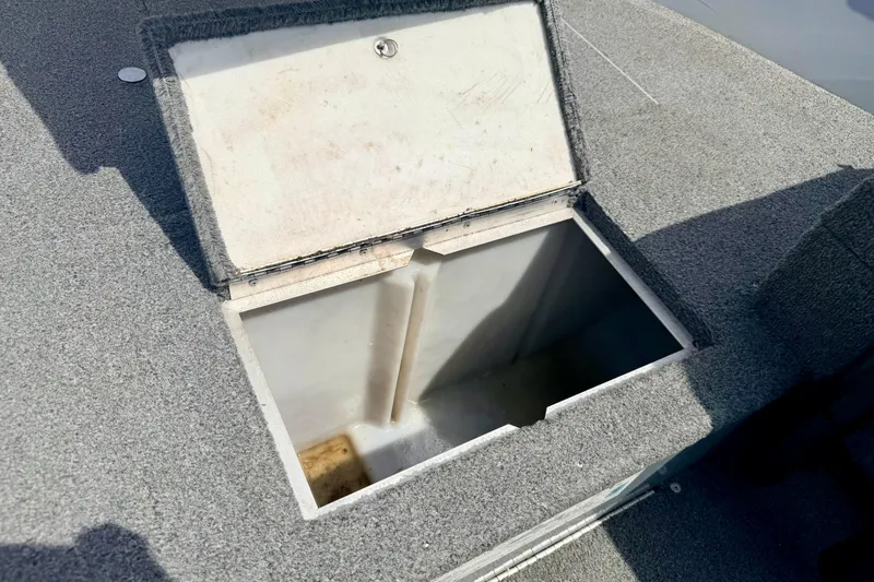 Slide: The Image of Open storage compartment on 2003 Lund 1675 Adventure SS boat deck. - 55