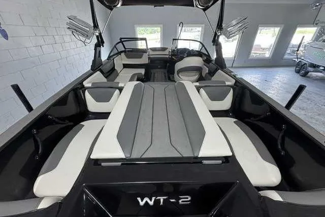 Slide: The Image of 2020 Heyday WT-2DC boat interior with sleek seating and modern design in a showroom. - 3